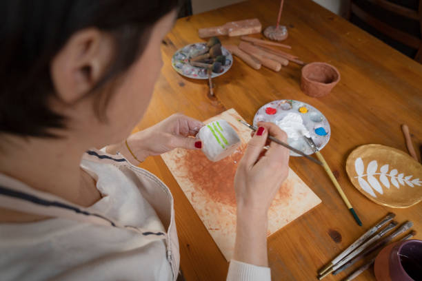 istock Woman painting a pottery 1466964131