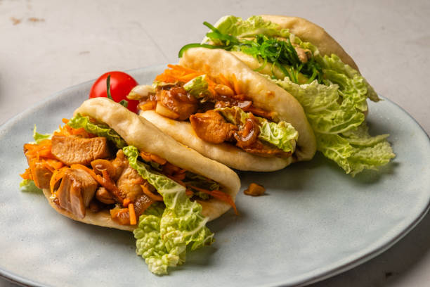 istock Three steamed bao buns filled with chicken 1466966196