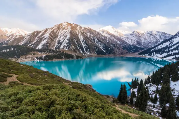 Photo of Scenic view of the Big Almaty Lake with Tianshan Mountains in Kazakhstan near the city of Almaty