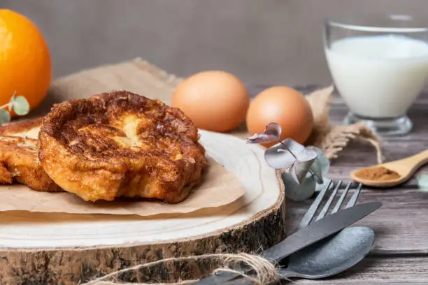 Photo of Torrijas. Close-up of the typical Spanish sweet made of bread, milk, eggs, sugar, cinnamon and orange zest that is consumed at Easter