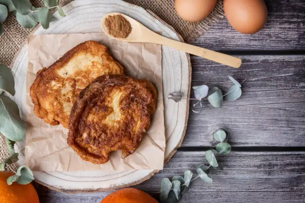 Photo of Torrijas. View from the top of the typical Spanish sweet made of bread, milk, sugar, eggs, cinnamon and orange zest that is consumed at Easter