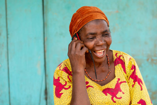 istock Happy elderly African woman making a phone call 1466968722
