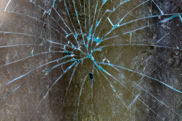 istock Closeup shot of a shattered glass surface 1466971278