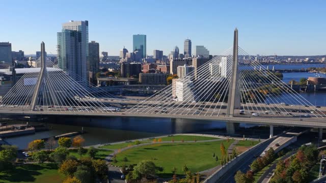 Aerial view of Boston Zakim Bridge in the summer with blue skies and highway traffic