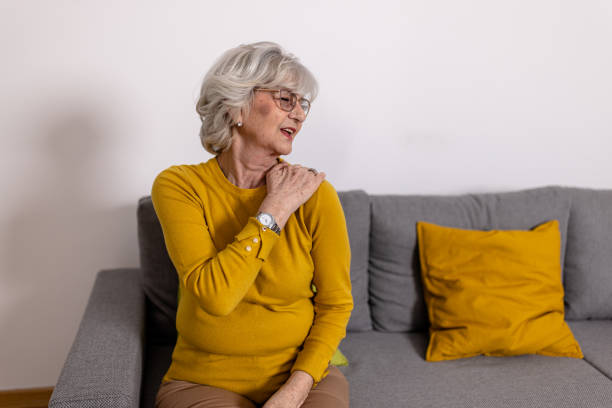 istock A lonely older woman with chronic shoulder problems is desperate while struggling with insufferable pain. 1466980218