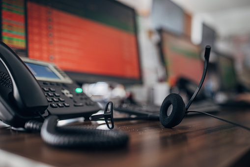 Taxi service operator equipment on desk in call center office.