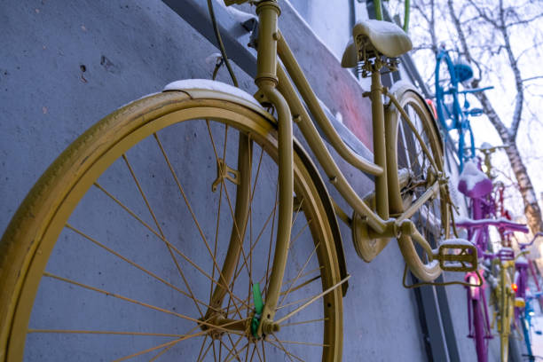 istock Old bicycles have become an art object in on a gray concrete wall 1466982092