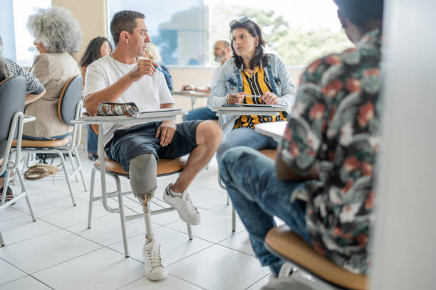 istock College student with prosthetic leg in college classroom 1466983982