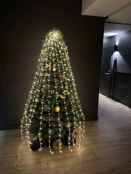 istock christmas tree with lights indoor 1466988380