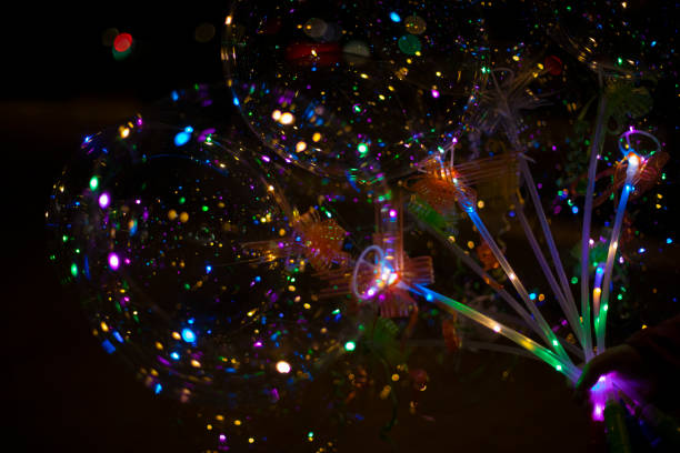 istock Colored balls in dark. LED Light. Transparent ball with colored lights. 1466991820
