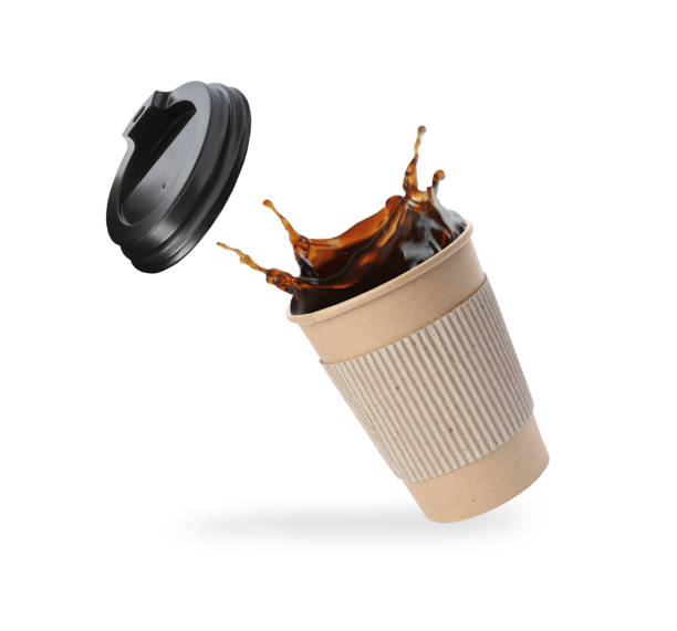 istock Takeaway paper cup with splashing coffee and plastic lid on white background 1466993518