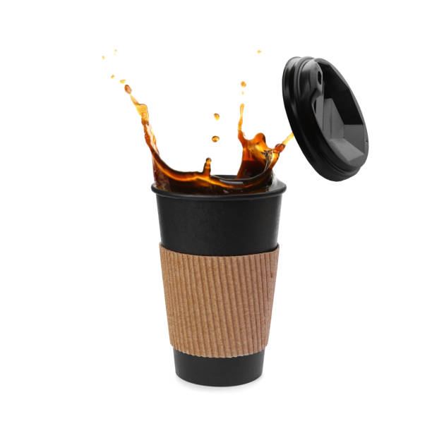 istock Takeaway paper cup with splashing coffee and plastic lid on white background 1466993547