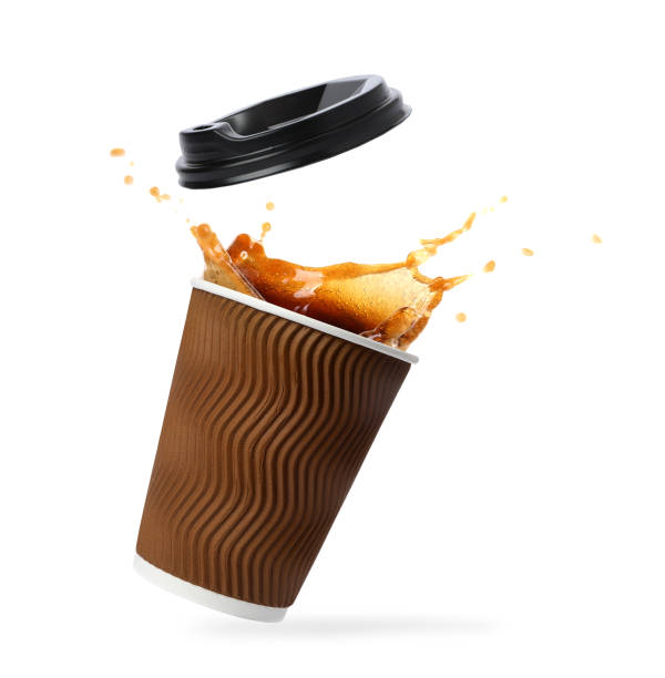 istock Takeaway paper cup with splashing coffee and plastic lid on white background 1466993590