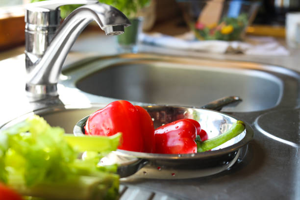 istock Colander with fresh bell peppers in kitchen sink 1466993780