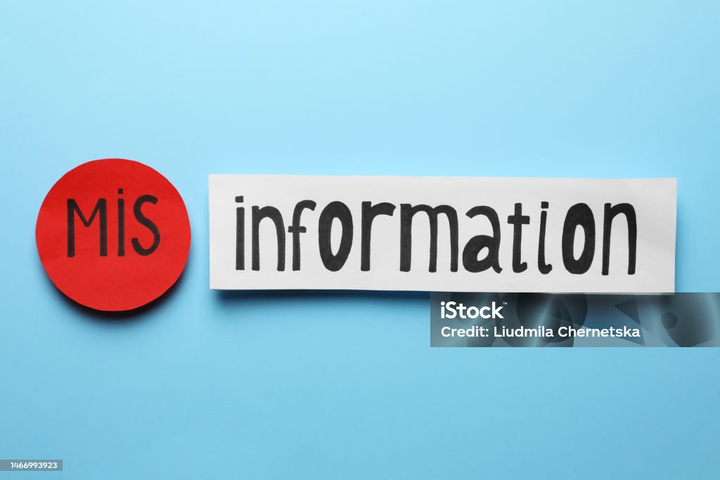 Word MISINFORMATION made with paper pieces on light blue background, flat lay Misinformation Stock Photo