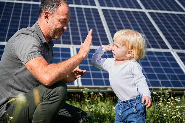 istock Smiling father and his little son giving each other high-five 1466995296