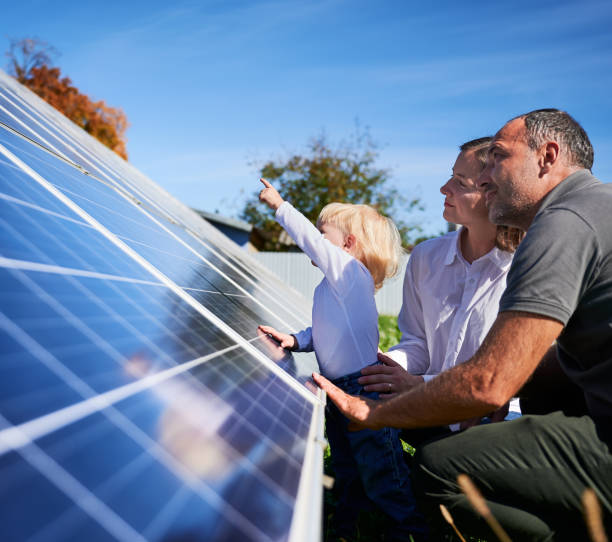 istock Enthusiastic father showing potential of alternative energy. 1466995379
