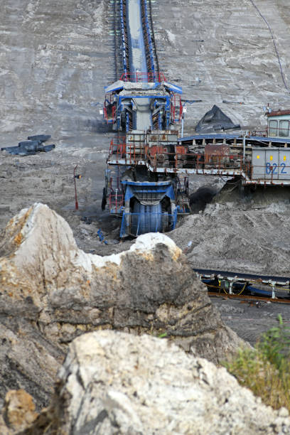 istock An interesting appearance of an open surface mine. Conveyor belt at a coal mine. A panoramic view of lignite exploitation. 1466995817