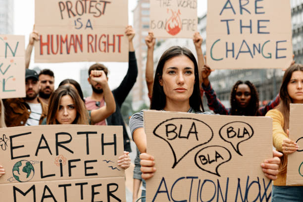 istock Activists demonstrating against global warming during climate rally 1466997110