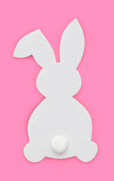 istock silhouette of a white rabbit on a pink background, Easter concept, postcard 1466997515