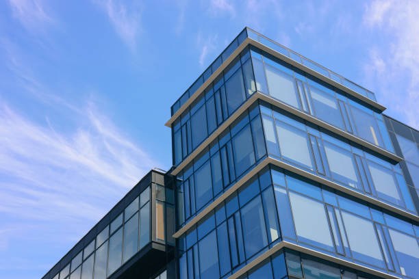 istock Low angle view of modern buildings against blue sky 1466997955