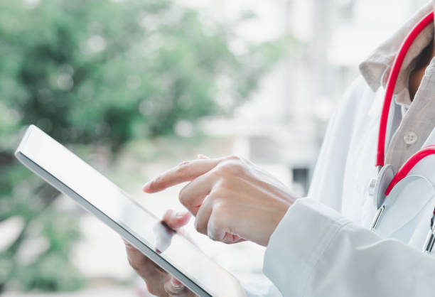 istock doctor, working, on tablet, close-up, medical technology concept. 1466998469