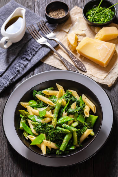 istock Pasta primavera with green veggies, cheese in bowl 1466998883