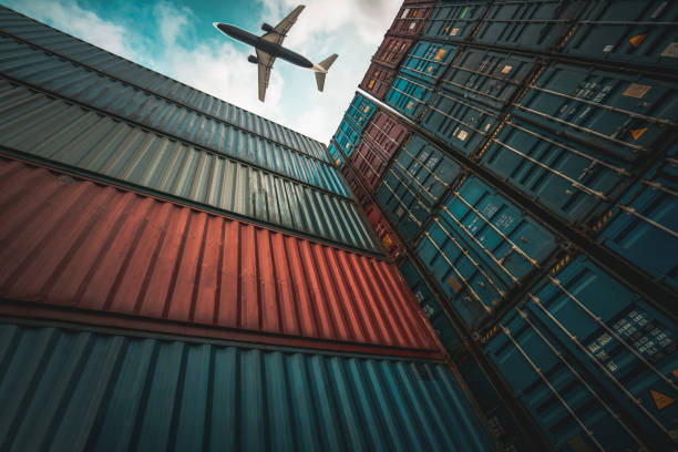 istock Freight airplane flying above overseas shipping container . Logistics supply chain management and international goods export concept . 1466998928