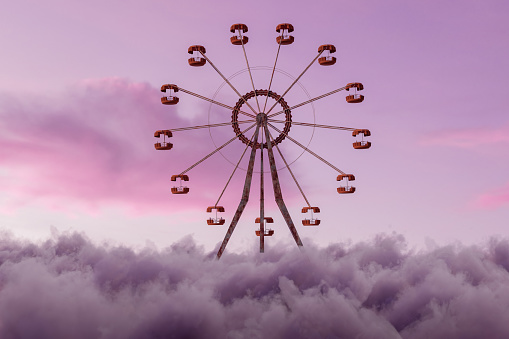 3D rendering of old ferris wheel over fluffy clouds in front of evening sky