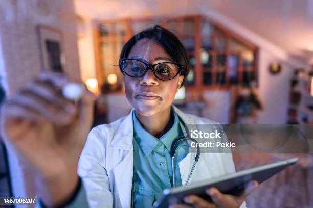 Scientist Writing In The Window At Office Stock Photo - Download Image Now - Dark, Mathematical Formula, Creativity