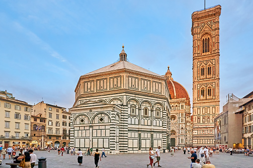 Florence, Italy - September 05, 2022: Crowd in front of Florence Santa Maria del Fiore Cathedral in the evening.