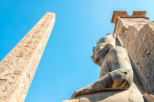 Obelisk and statue in Luxor Temple, Egypt