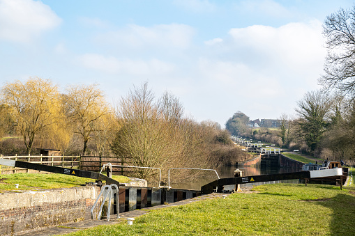 The steep canal system of locks on the Kennet and Avon canal at Caen Hill in Wiltshire, UK