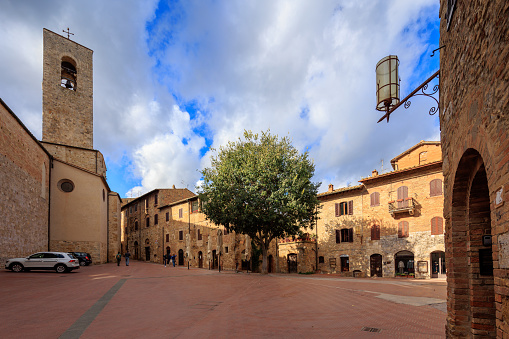 San Gimignano street life, old tuscan town in Italy