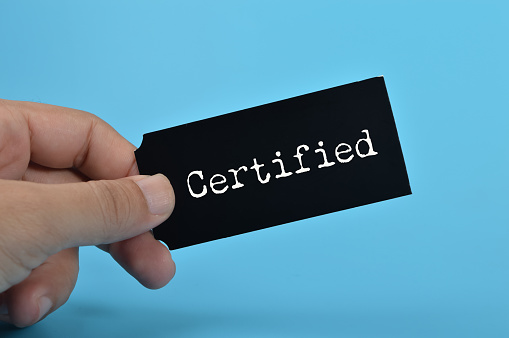 Black card written with CERTIFIED. Having a certified professional gives clients the assurance and confidence that they are working with someone who has undergone rigorous training