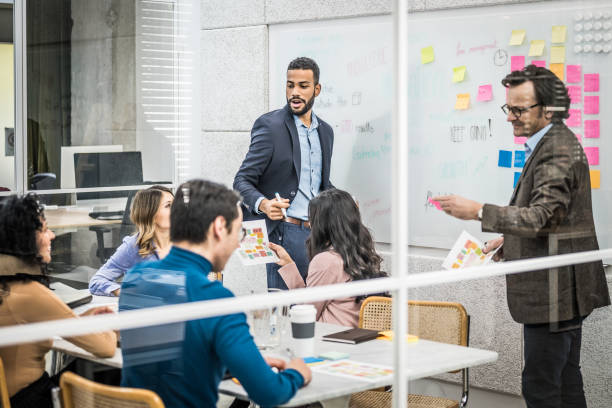 istock Company employees teamwork and brainstorming in conference room 1467012414