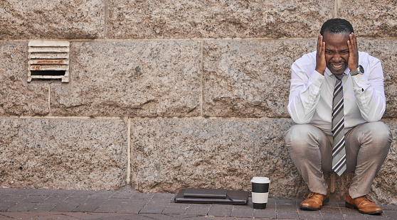 Business, depression and sad black man in city after failure, financial crisis or mistake mockup. Mental health, anxiety or stress, unemployed or unhappy businessman in street thinking about job loss