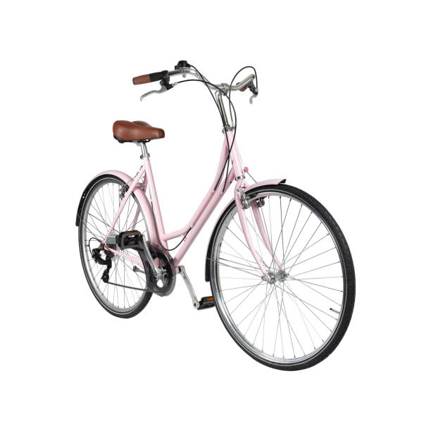 Pink retro bicycle with brown saddle and handles, generic bike side view stock photo