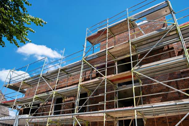 istock Scaffolding near a high-rise brick house under construction in Germany. 1467020047