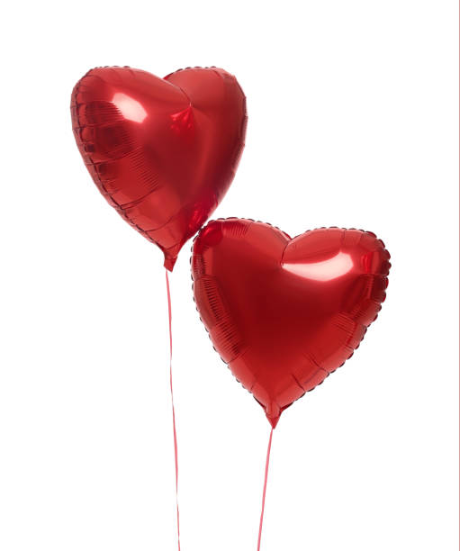 istock Beautiful red heart shaped balloons isolated on white. Valentine's day celebration 1467021031
