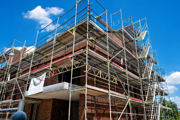 istock Scaffolding near a high-rise brick house under construction in Germany. 1467021054
