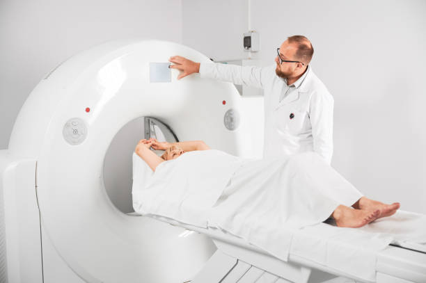 Radiologist making medical computed tomography or MRI. stock photo