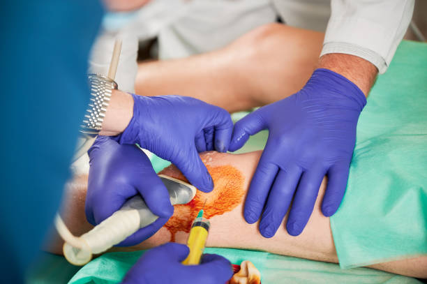 istock Doctor and nurse making injection in knee. 1467023126