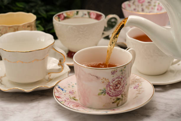 istock Porcelain cups with black tea with slice of lemon 1467025974