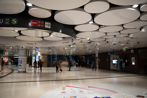 Munich, Germany- 09-26-2022: Interior of Karlsplatz U-bahn station with orb-like ceiling pattern.