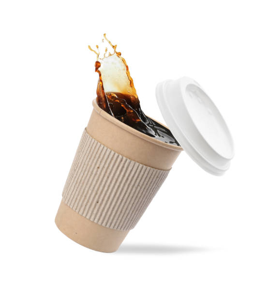 takeaway paper cup with splashing coffee and plastic lid on white background - take out food coffee nobody disposable cup imagens e fotografias de stock