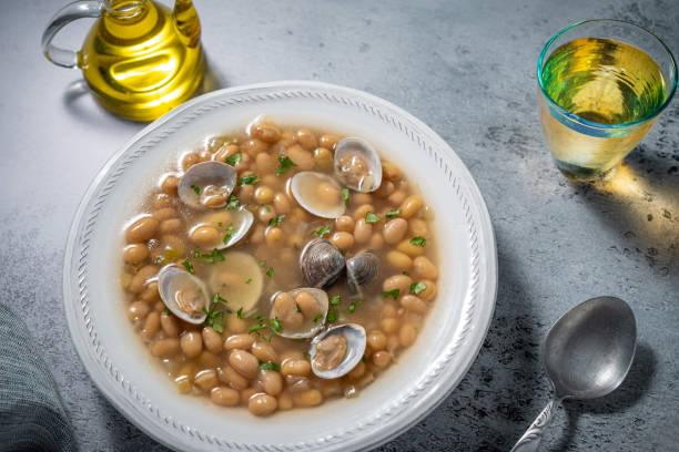 Pochas Fabes con Almejas from Asturias Spain white beans clams stew Pochas Fabes con Almejas from Asturias in Spain white beans traditional stew with clams, Mediterranean food fabes stock pictures, royalty-free photos & images