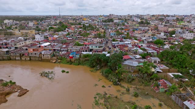 Muddy Water Of Yuma River Overflown In Los Platanitos Community During Hurricane Fiona In Dominican Republic. - aerial