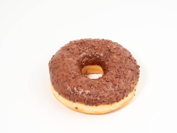 istock Chocolate donut with chocolate chips on a white background. 1467034946