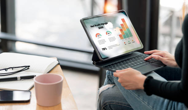 istock Young woman manage business from home on remote, business data dashboard provide modish business intelligence analytic for marketing strategy planning 1467034951